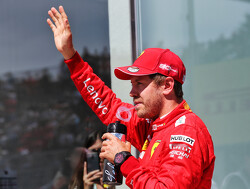 Vettel 'happy' for Ferrari after tough run