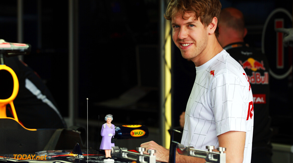 141015472KR010_F1_Grand_Pri
MELBOURNE, AUSTRALIA - MARCH 15:  Sebastian Vettel of Germany and Red Bull Racing looks at a model of Queen Elizabeth on top of his car in his team garage during previews to the Australian Formula One Grand Prix at the Albert Park circuit on March 15, 2012 in Melbourne, Australia.  (Photo by Mark Thompson/Getty Images) *** Local Caption *** Sebastian Vettel
F1 Grand Prix Of Australia - Previews
Mark Thompson
Melbourne
Australia

Formula One Racing F1