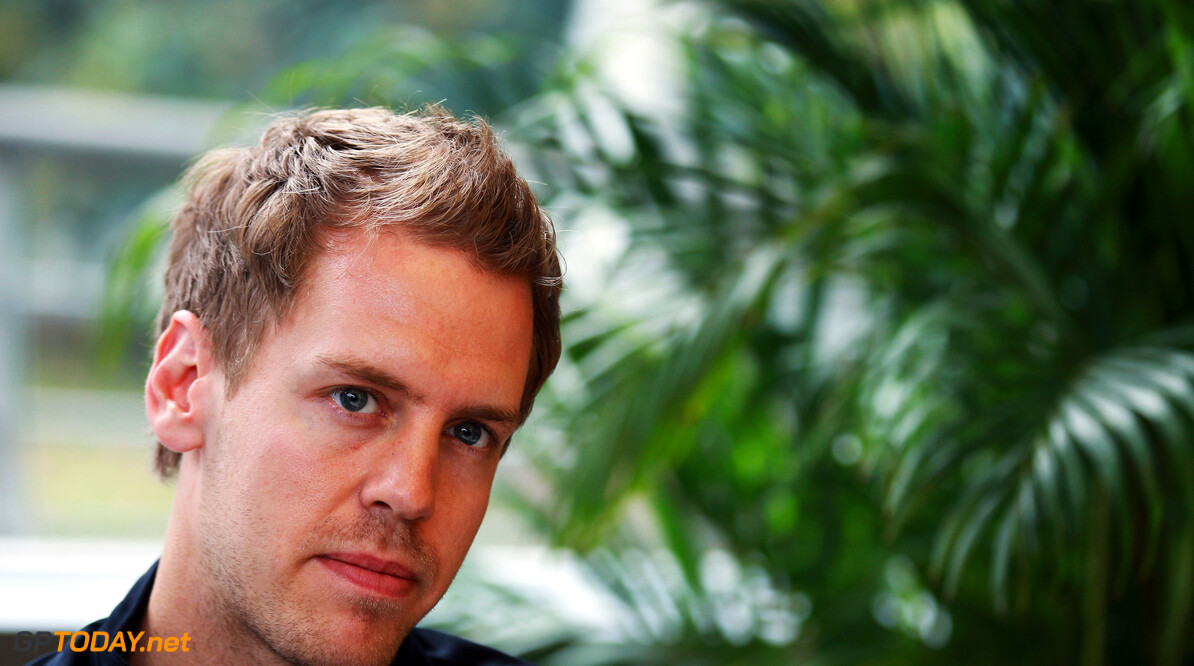 141015604KR089_Chinese_F1_G
SHANGHAI, CHINA - APRIL 12:  Sebastian Vettel of Germany and Red Bull Racing is interviewed by the media during previews to the Chinese Formula One Grand Prix at the Shanghai International Circuit on April 12, 2012 in Shanghai, China.  (Photo by Mark Thompson/Getty Images) *** Local Caption *** Sebastian Vettel
Chinese F1 Grand Prix - Previews
Mark Thompson
Shanghai
China

Formula One Racing F1