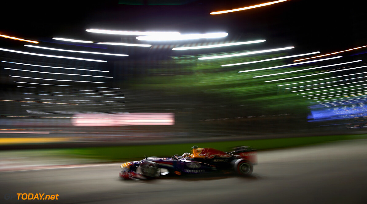 SINGAPORE - SEPTEMBER 21:  Sebastian Vettel of Germany and Red Bull drives during qualifying for the Singapore Formula One Grand Prix at Marina Bay Street Circuit on September 21, 2013 in Singapore, Singapore.  (Photo by Clive Mason/Getty Images) *** Local Caption *** Sebastian Vettel
F1 Grand Prix of Singapore - Qualifying
Clive Mason
Singapore
Singapore