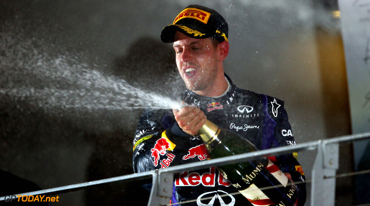 SINGAPORE - SEPTEMBER 22:  Sebastian Vettel of Germany and Infiniti Red Bull racing celebrates following his victory during the Singapore Formula One Grand Prix at Marina Bay Street Circuit on September 22, 2013 in Singapore, Singapore.  (Photo by Paul Gilham/Getty Images) *** Local Caption *** Sebastian Vettel
F1 Grand Prix of Singapore
Paul Gilham
Singapore
Singapore