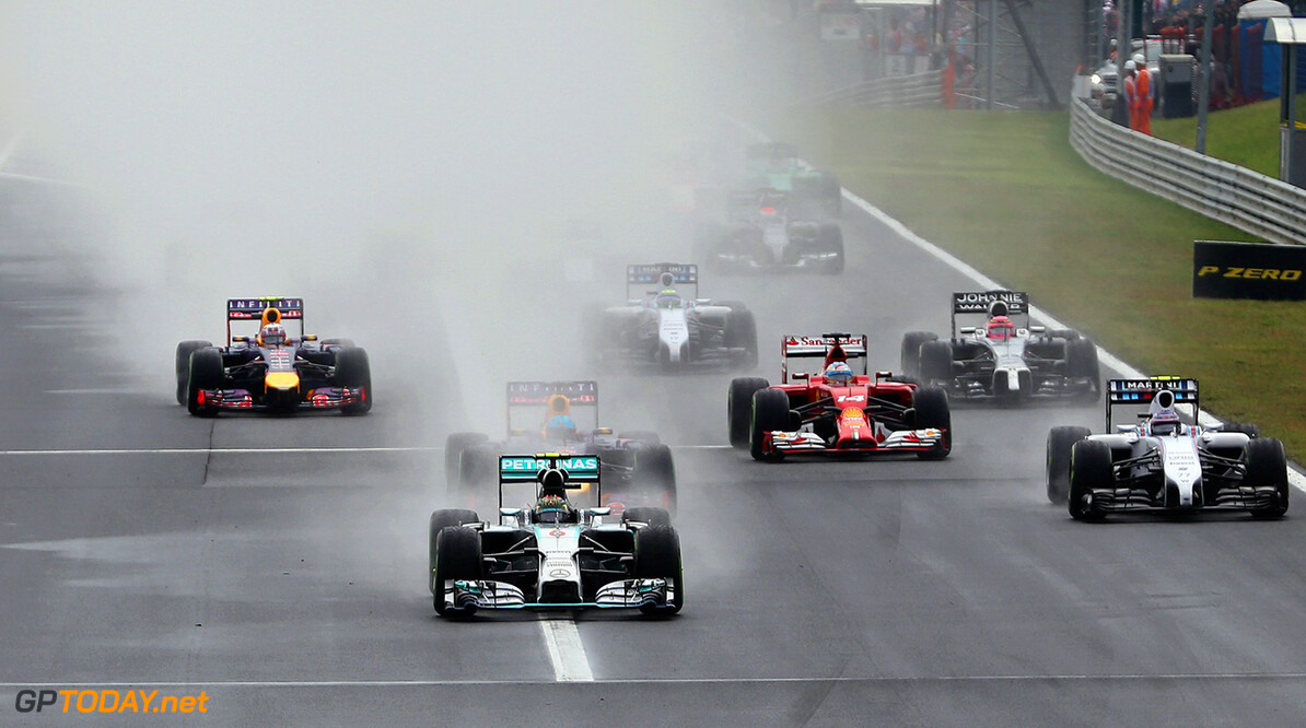 BUDAPEST, HUNGARY - JULY 27:  Nico Rosberg of Germany and Mercedes GP leads the field into the first corner during the Hungarian Formula One Grand Prix at Hungaroring on July 27, 2014 in Budapest, Hungary.  (Photo by Mark Thompson/Getty Images) *** Local Caption *** Nico Rosberg
F1 Grand Prix of Hungary
Mark Thompson
Budapest
Hungary

Formula One Racing formula 1 Auto Racing Formula One Grand Prix