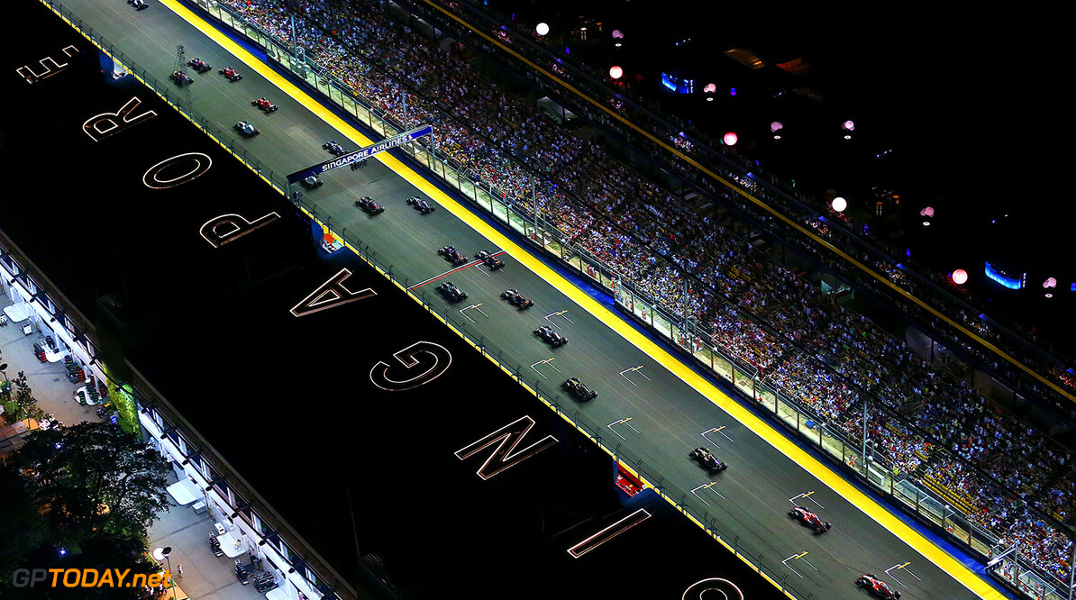 SINGAPORE - SEPTEMBER 21:  Lewis Hamilton of Great Britain and Mercedes GP leads the field into the first corner during the Singapore Formula One Grand Prix at Marina Bay Street Circuit on September 21, 2014 in Singapore, Singapore.  (Photo by Dan Istitene/Getty Images) *** Local Caption *** Lewis Hamilton
F1 Grand Prix of Singapore
Dan Istitene
Singapore
Singapore

Formula One Racing formula 1 Auto Racing Formula One Grand Prix Marina Bay Street Circuit Singapore Grand Prix