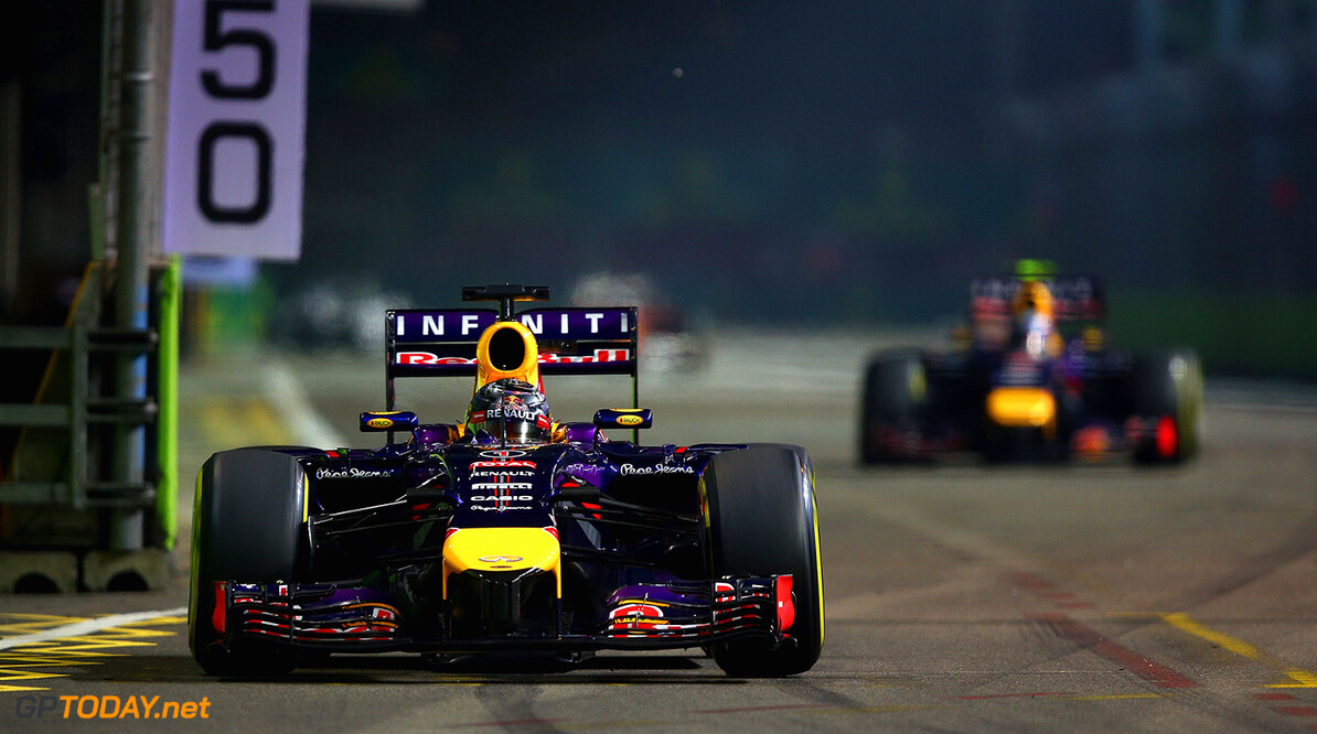 SINGAPORE - SEPTEMBER 21:  Sebastian Vettel of Germany and Infiniti Red Bull Racing drives ahead of Daniel Ricciardo of Australia and Infiniti Red Bull Racing during the Singapore Formula One Grand Prix at Marina Bay Street Circuit on September 21, 2014 in Singapore, Singapore.  (Photo by Clive Mason/Getty Images) *** Local Caption *** Sebastian Vettel;Daniel Ricciardo
F1 Grand Prix of Singapore
Clive Mason
Singapore
Singapore

Formula One Racing formula 1 Auto Racing Formula One Grand Prix Marina Bay Street Circuit Singapore Grand Prix