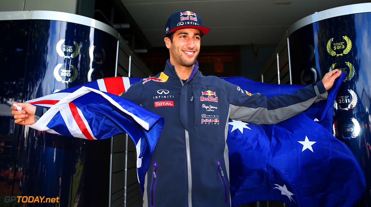 MELBOURNE, AUSTRALIA - MARCH 12:  Daniel Ricciardo of Australia and Infiniti Red Bull Racing poses with the Australian national flag outside the team garage during previews to the Australian Formula One Grand Prix at Albert Park on March 12, 2015 in Melbourne, Australia.  (Photo by Robert Cianflone/Getty Images) // Getty Images/Red Bull Content Pool // P-20150312-00129 // Usage for editorial use only // Please go to www.redbullcontentpool.com for further information. // 
Australian F1 Grand Prix - Previews
Robert Cianflone
Melbourne
Australia

P-20150312-00129
