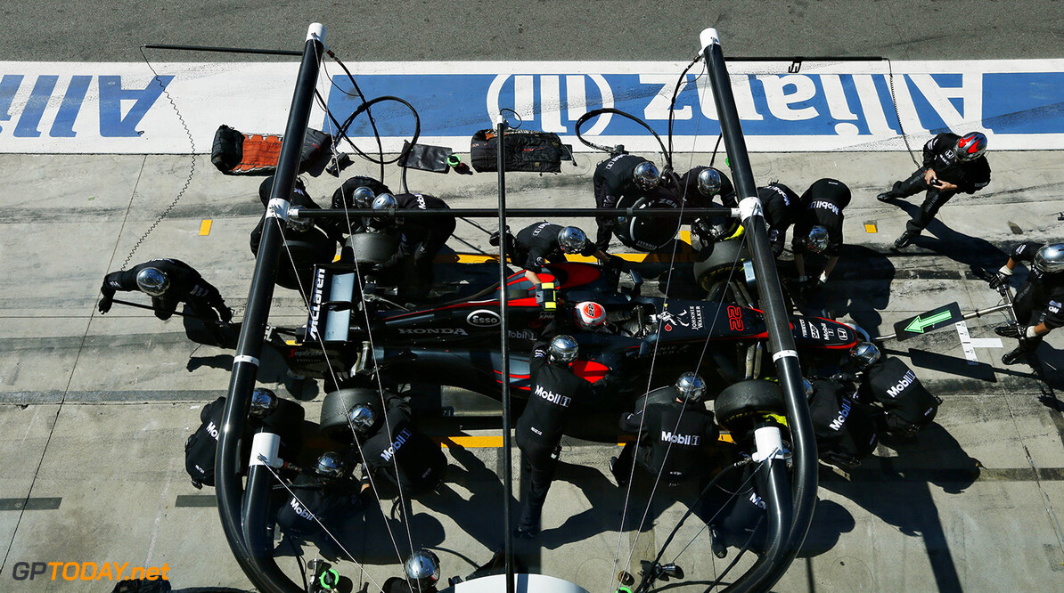 Jenson Button makes a pit stop.