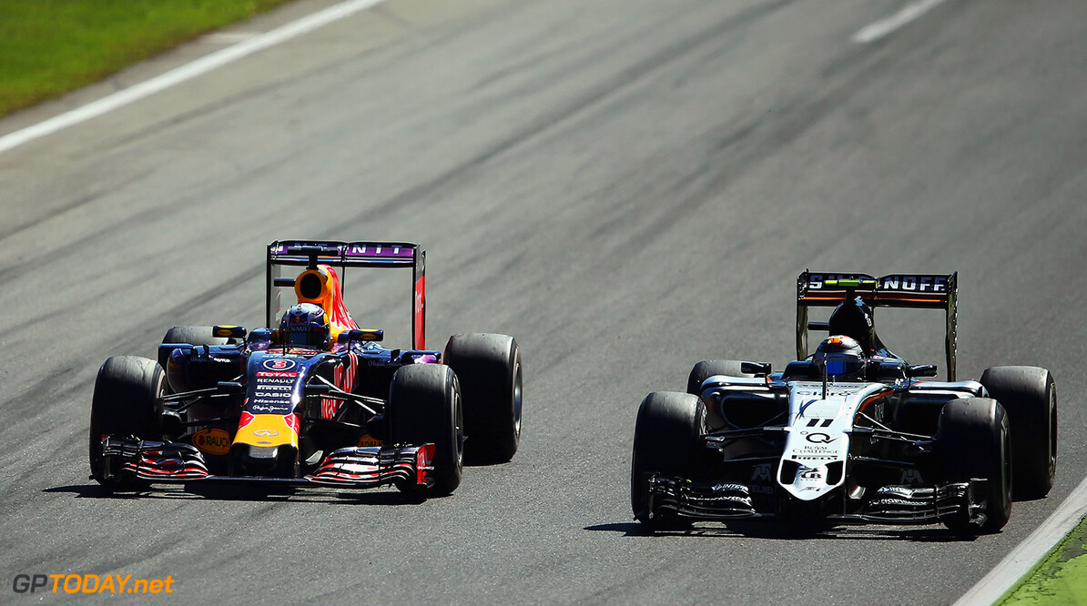 MONZA, ITALY - SEPTEMBER 06:  Daniel Ricciardo of Australia and Infiniti Red Bull Racing drives next to Sergio Perez of Mexico and Force India during the Formula One Grand Prix of Italy at Autodromo di Monza on September 6, 2015 in Monza, Italy.  (Photo by Bryn Lennon/Getty Images) // Getty Images/Red Bull Content Pool // P-20150906-00906 // Usage for editorial use only // Please go to www.redbullcontentpool.com for further information. // 
F1 Grand Prix of Italy
Bryn Lennon
Monza
Italy

P-20150906-00906