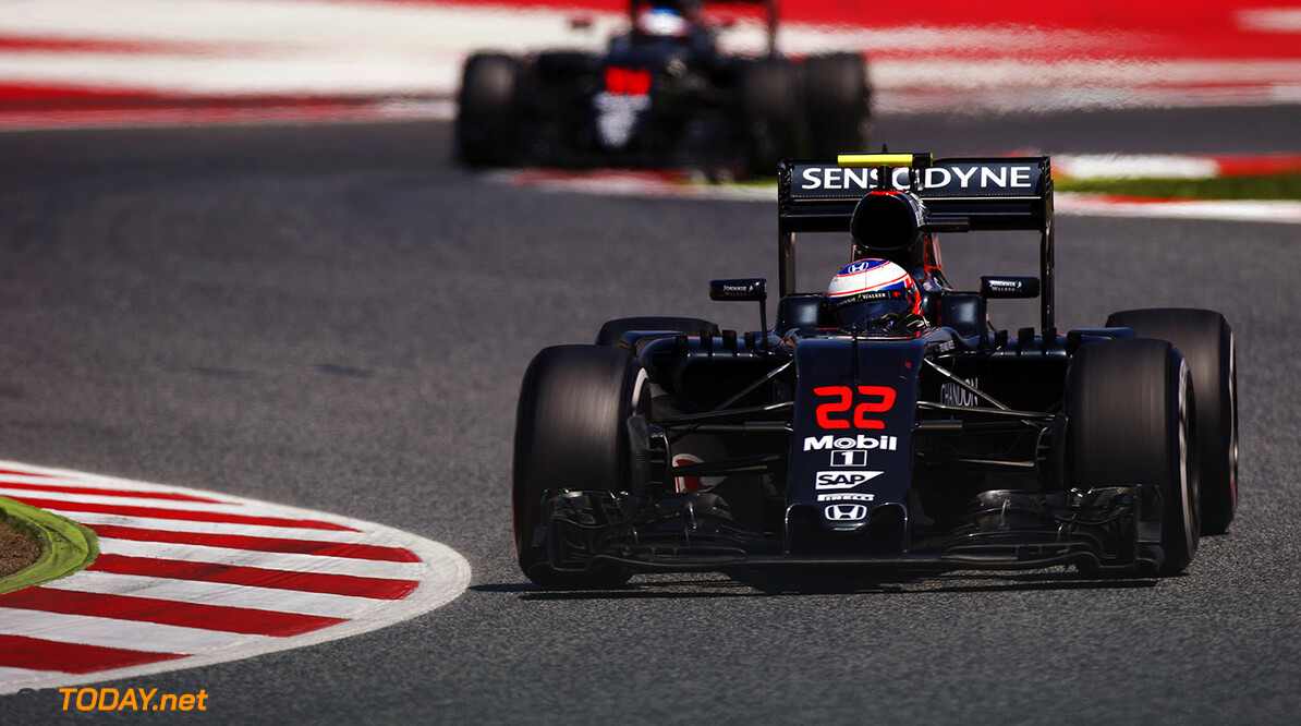 Jenson Button on track ahead of Fernando Alonso.