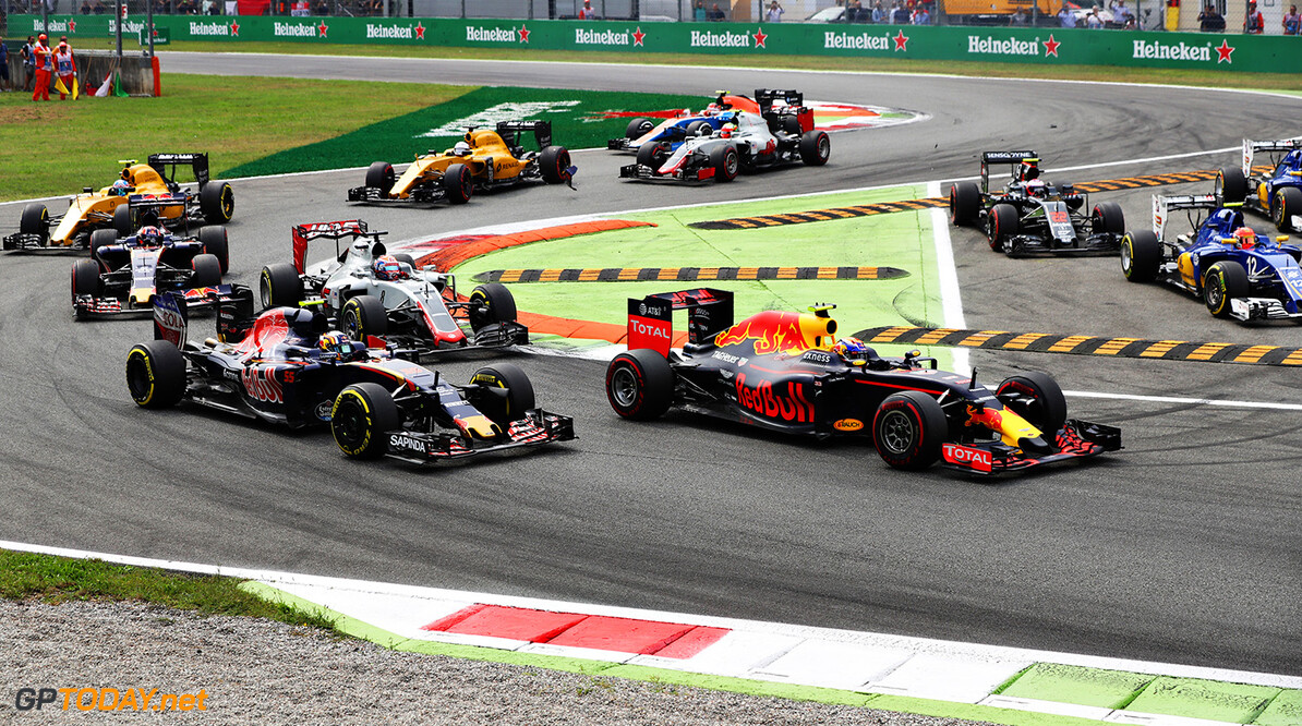 MONZA, ITALY - SEPTEMBER 04: Max Verstappen of the Netherlands driving the (33) Red Bull Racing Red Bull-TAG Heuer RB12 TAG Heuer leads Carlos Sainz of Spain driving the (55) Scuderia Toro Rosso STR11 Ferrari 060/5 turbo and a line of cars at the start during the Formula One Grand Prix of Italy at Autodromo di Monza on September 4, 2016 in Monza, Italy.  (Photo by Mark Thompson/Getty Images) // Getty Images / Red Bull Content Pool  // P-20160904-01451 // Usage for editorial use only // Please go to www.redbullcontentpool.com for further information. // 
F1 Grand Prix of Italy
Mark Thompson
Monza
Italy

P-20160904-01451