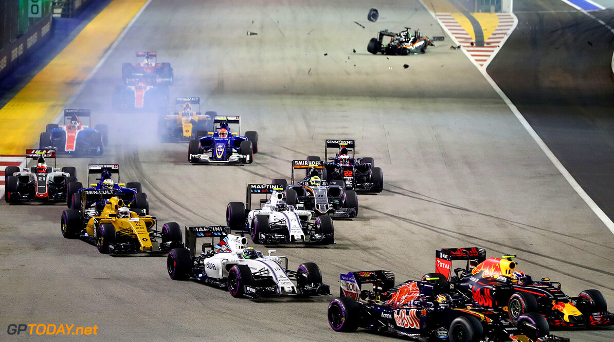 SINGAPORE - SEPTEMBER 18: Carlos Sainz of Spain driving the (55) Scuderia Toro Rosso STR11 Ferrari 060/5 turbo and Max Verstappen of the Netherlands driving the (33) Red Bull Racing Red Bull-TAG Heuer RB12 TAG Heuer battle for position ahead of Valtteri Bottas of Finland driving the (77) Williams Martini Racing Williams FW38 Mercedes PU106C Hybrid turbo, Felipe Massa of Brazil driving the (19) Williams Martini Racing Williams FW38 Mercedes PU106C Hybrid turbo at the start during the Formula One Grand Prix of Singapore at Marina Bay Street Circuit on September 18, 2016 in Singapore.  (Photo by Lars Baron/Getty Images) // Getty Images / Red Bull Content Pool  // P-20160918-01054 // Usage for editorial use only // Please go to www.redbullcontentpool.com for further information. // 
F1 Grand Prix of Singapore
Lars Baron
Singapore
Singapore

P-20160918-01054