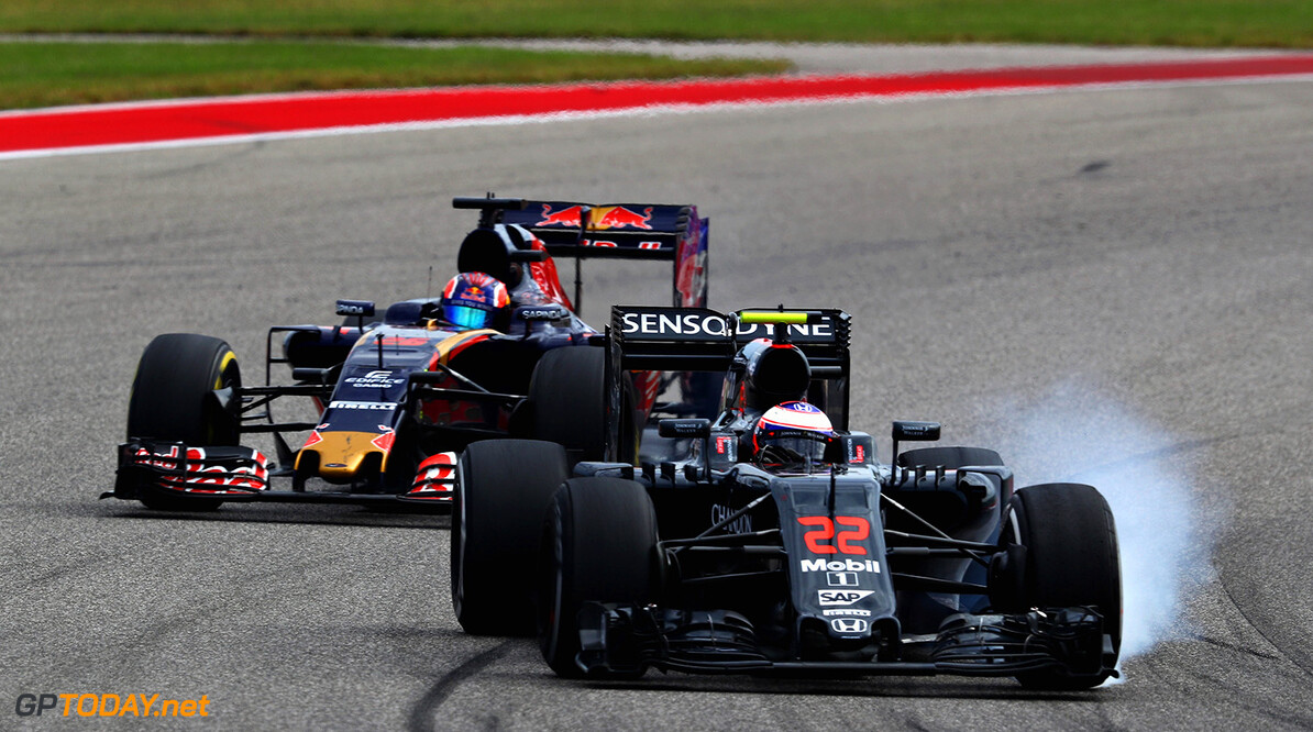 AUSTIN, TX - OCTOBER 23: Jenson Button of Great Britain driving the (22) McLaren Honda Formula 1 Team McLaren MP4-31 Honda RA616H Hybrid turbo locks a wheel under braking defending against Daniil Kvyat of Russia driving the (26) Scuderia Toro Rosso STR11 Ferrari 060/5 turbo on track during the United States Formula One Grand Prix at Circuit of The Americas on October 23, 2016 in Austin, United States.  (Photo by Clive Mason/Getty Images) // Getty Images / Red Bull Content Pool  // P-20161023-00761 // Usage for editorial use only // Please go to www.redbullcontentpool.com for further information. // 
F1 Grand Prix of USA
Clive Mason



P-20161023-00761