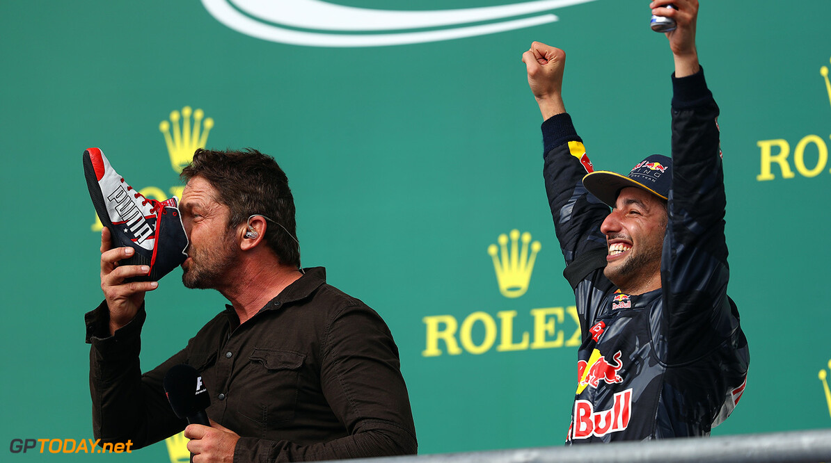 AUSTIN, TX - OCTOBER 23:  Actor Gerard Butler does a shoey on the podium with Daniel Ricciardo of Australia and Red Bull Racing after Daniel finished third in the race during the United States Formula One Grand Prix at Circuit of The Americas on October 23, 2016 in Austin, United States.  (Photo by Clive Mason/Getty Images) // Getty Images / Red Bull Content Pool  // P-20161023-01069 // Usage for editorial use only // Please go to www.redbullcontentpool.com for further information. // 
F1 Grand Prix of USA
Clive Mason
Austin
United States

P-20161023-01069