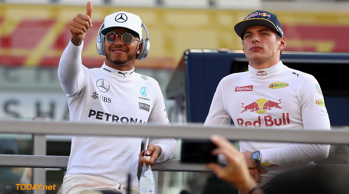 ABU DHABI, UNITED ARAB EMIRATES - NOVEMBER 27:  Lewis Hamilton of Great Britain and Mercedes GP and Max Verstappen of Netherlands and Red Bull Racing on the drivers parade before the Abu Dhabi Formula One Grand Prix at Yas Marina Circuit on November 27, 2016 in Abu Dhabi, United Arab Emirates.  (Photo by Clive Mason/Getty Images) // Getty Images / Red Bull Content Pool  // P-20161127-00202 // Usage for editorial use only // Please go to www.redbullcontentpool.com for further information. // 
F1 Grand Prix of Abu Dhabi
Clive Mason
Abu Dhabi
United Arab Emirates

P-20161127-00202