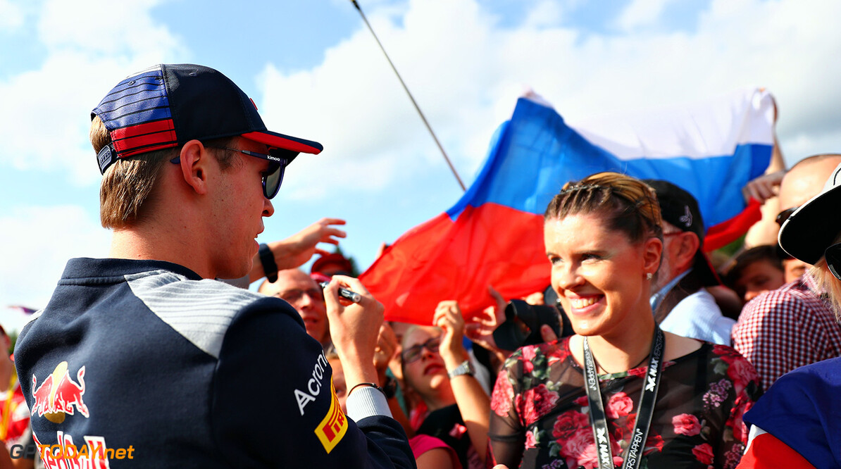 SPA, BELGIUM - AUGUST 24: Daniil Kvyat of Russia and Scuderia Toro Rosso signs autographs for fans during previews ahead of the Formula One Grand Prix of Belgium at Circuit de Spa-Francorchamps on August 24, 2017 in Spa, Belgium.  (Photo by Dan Istitene/Getty Images) // Getty Images / Red Bull Content Pool  // P-20170824-01433 // Usage for editorial use only // Please go to www.redbullcontentpool.com for further information. // 
F1 Grand Prix of Belgium - Previews
Dan Istitene
Spa
Belgium

P-20170824-01433