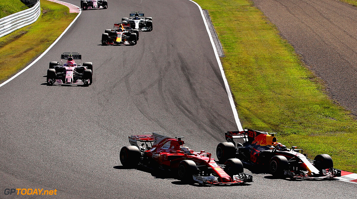 SUZUKA, JAPAN - OCTOBER 08: Max Verstappen of the Netherlands driving the (33) Red Bull Racing Red Bull-TAG Heuer RB13 TAG Heuer overtakes Sebastian Vettel of Germany driving the (5) Scuderia Ferrari SF70H for second place during the Formula One Grand Prix of Japan at Suzuka Circuit on October 8, 2017 in Suzuka.  (Photo by Clive Mason/Getty Images) // Getty Images / Red Bull Content Pool  // P-20171008-00538 // Usage for editorial use only // Please go to www.redbullcontentpool.com for further information. // 
F1 Grand Prix of Japan
Clive Mason
Suzuka
Japan

P-20171008-00538