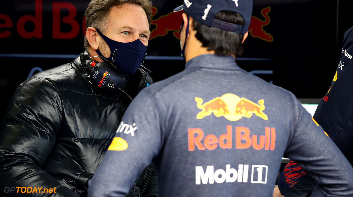 NORTHAMPTON, ENGLAND - FEBRUARY 24: Sergio Perez of Mexico and Red Bull Racing talks with Red Bull Racing Team Principal Christian Horner in the garage during the Red Bull Racing Filming Day at Silverstone on February 24, 2021 in Northampton, England. (Photo by Mark Thompson/Getty Images for Red Bull Racing) // Getty Images / Red Bull Content Pool  // SI202102240179 // Usage for editorial use only // 
Sergio P?? 1/2 rez and Christian Horner




SI202102240179