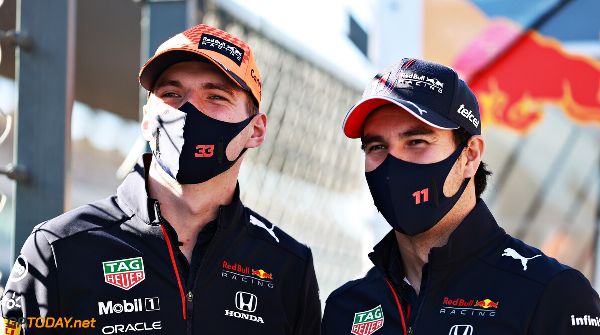 PORTIMAO, PORTUGAL - APRIL 29: Max Verstappen of Netherlands and Red Bull Racing and Sergio Perez of Mexico and Red Bull Racing talk on the pitwall during previews ahead of the F1 Grand Prix of Portugal at Autodromo Internacional Do Algarve on April 29, 2021 in Portimao, Portugal. (Photo by Mark Thompson/Getty Images) // Getty Images / Red Bull Content Pool  // SI202104290416 // Usage for editorial use only // 
F1 Grand Prix of Portugal - Previews




SI202104290416