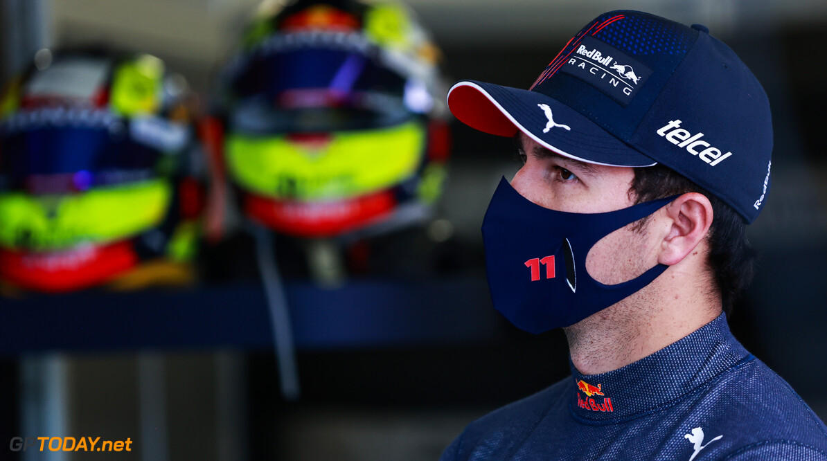 BAKU, AZERBAIJAN - JUNE 04: Sergio Perez of Mexico and Red Bull Racing looks on in the garage during practice ahead of the F1 Grand Prix of Azerbaijan at Baku City Circuit on June 04, 2021 in Baku, Azerbaijan. (Photo by Mark Thompson/Getty Images) // Getty Images / Red Bull Content Pool  // SI202106040156 // Usage for editorial use only // 
F1 Grand Prix of Azerbaijan - Practice




SI202106040156