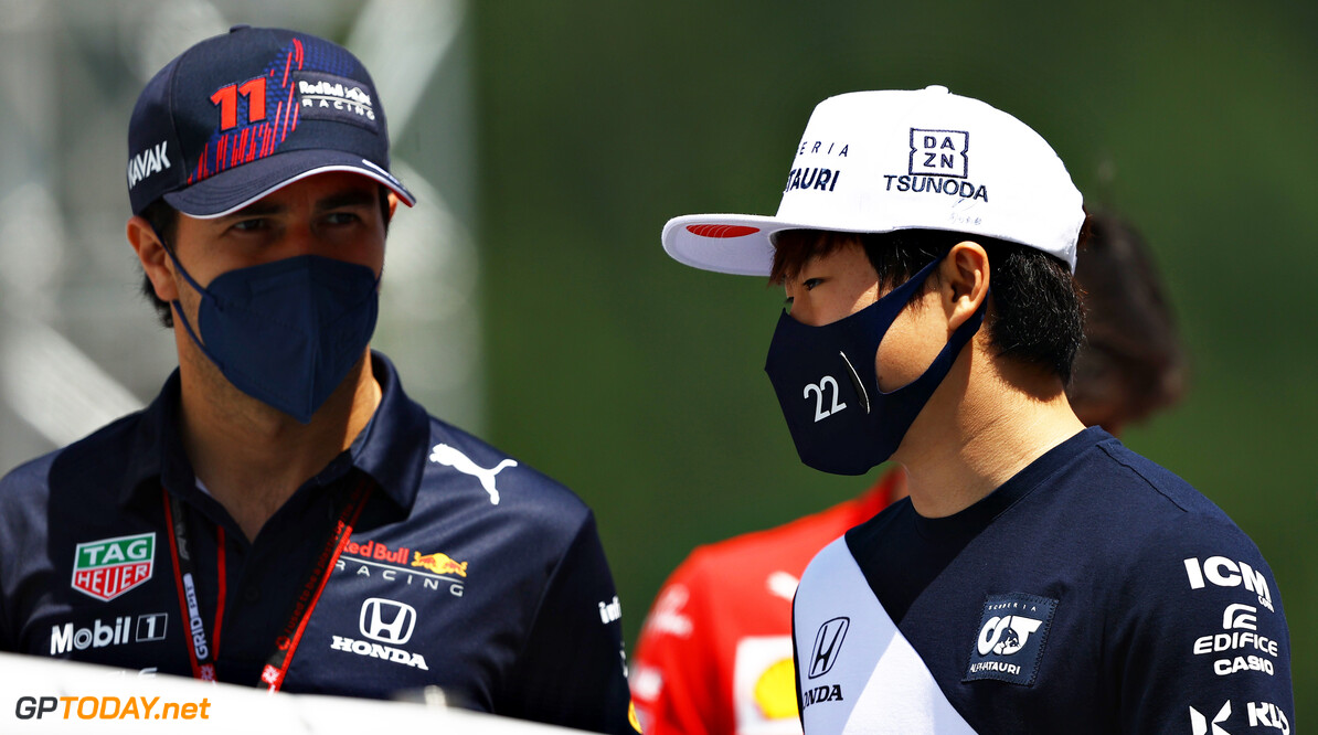 SPIELBERG, AUSTRIA - JUNE 27: Sergio Perez of Mexico and Red Bull Racing and Yuki Tsunoda of Japan and Scuderia AlphaTauri talk on the drivers parade ahead of the F1 Grand Prix of Styria at Red Bull Ring on June 27, 2021 in Spielberg, Austria. (Photo by Bryn Lennon/Getty Images) // Getty Images / Red Bull Content Pool  // SI202106270148 // Usage for editorial use only // 
F1 Grand Prix of Styria




SI202106270148