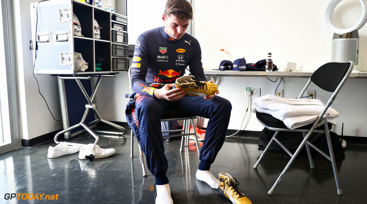 ABU DHABI, UNITED ARAB EMIRATES - DECEMBER 14: Max Verstappen of Netherlands and Red Bull Racing prepares to drive with a pair of gold Puma race boots during Formula 1 testing at Yas Marina Circuit on December 14, 2021 in Abu Dhabi, United Arab Emirates. (Photo by Clive Rose/Getty Images) // Getty Images / Red Bull Content Pool  // SI202112140106 // Usage for editorial use only // 
Formula 1 Testing in Abu Dhabi - Day One




SI202112140106