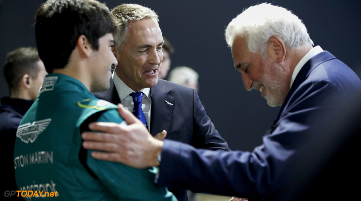 Portrait, Aston Martin Lagonda Global Headquarters, LCH2201a, F1, GP, Great Britain
Lawrence Stroll, co-owner of Aston Martin, talks to Martin Whitmarsh, CEO of Aston Martin F1 and Lance Stroll, Aston Martin

Zak Mauger
Gaydon
Great Britain

Portrait  LCH2201a  F1  GP  Aston Martin Lagonda Global Headquarters  Great Britain  Apparel  Audience  Clothing  Coat  Crowd  Human  Overcoat  Person  Speech  Suit