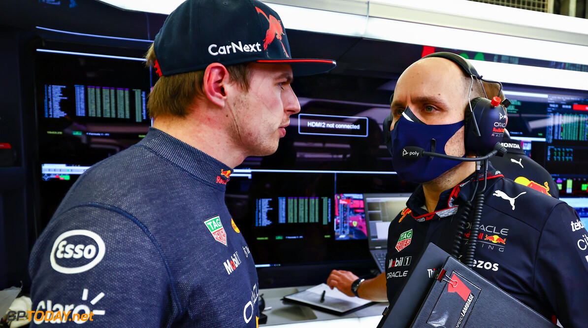BAHRAIN, BAHRAIN - MARCH 12: Max Verstappen of the Netherlands and Oracle Red Bull Racing talks with race engineer Gianpiero Lambiase in the garage during Day Three of F1 Testing at Bahrain International Circuit on March 12, 2022 in Bahrain, Bahrain. (Photo by Mark Thompson/Getty Images) // Getty Images / Red Bull Content Pool // SI202203120128 // Usage for editorial use only // 
Formula 1 Testing in Bahrain - Day 3




SI202203120128